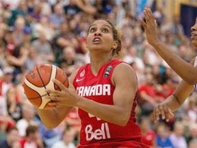 Miah-Marie Langlois of Canada sets up for a shot under the hoop against Yamel Abreu of Dominican Republic during a FIBA Americas Women’s Championship game at the Saville Community Sports Centre on Aug. 11, 2015.