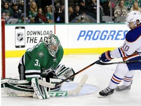 Nail Yakupov of the Edmonton Oilers fails to score on Dallas Stars goalie Kari Lehtonen during a National Hockey League game in Dallas on Nov. 25, 2014.