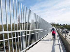 Newly installed anti-suicide fences are pictured along the Iron Workers Memorial bridge linking Burnaby and North Vancouver, B.C., in this March 31, 2015 photo. Researchers in Montreal calculate the true rate of suicide may be as much as 40-per-cent higher than reported in some provinces.