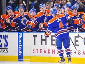 The Oilers bench celebrates with Taylor Hall (4) after scoring his third goal against the Montreal Canadiens at Rexall Place last October. There are plenty of questions heading into September’s training camp about how the team will be organized when the 2015-16 season begins.