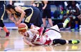 Ontario’s Bridget Mulholland (10) and Manitoba’s Raizel Guinto (6) collide during the U17 gold medal match at the 2015 Girls’ U15 & U17 National Basketball Championships at the Saville Sports Centre in Edmonton on July 29, 2015. Ontario won the game.