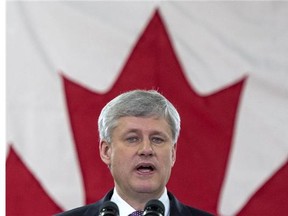 Conservative leader Stephen Harper addresses workers and supporters while touring a ceramic tile and granite distributor Tuesday, August 4, 2015 in Toronto.