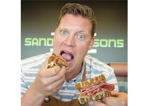 Owner/chef Alex Sneazwell of Sandwich & Sons slicing meat and assembling the Montreal smoked meat sandwich he will serve at Taste of Edmonton.