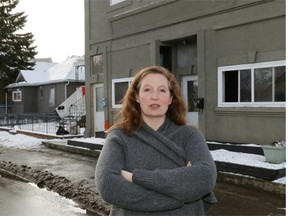 Parkdale resident Tracy Patience stands beside some residential properties owned by Carmen Pervez located near 112th Avenue and 86th Street.
