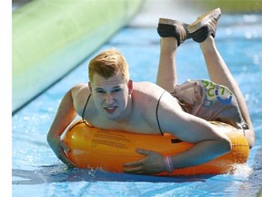 People of all ages got wet and wild at the Slide the City event on Grierson Hill in Edmonton on July 18, 2015.