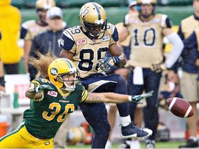 Saskatchewan’s rookie quarterback Brett Smith will face an Eskimos defence that is on a roll, including Aaron Grymes (36), battling here with Winnipeg Blue Bombers Clarence Denmark (89) for the football during the July 25 game at Commonwealth Stadium.