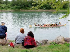 Spectators watch the Dragon Boat Festival and Pink Ribbon Challenge at Louise McKinney Riverfront Park on Aug. 16, 2015.
