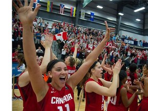 Canada celebrates a win over Cuba 82-66 for the gold at the FIBA Americas Women's Basketball tournament in Edmonton on Aug. 16, 2015