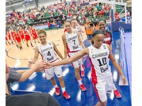 Team Canada celebrates its victory over Chile in a FIBA Americas Women’s Championship basketball game at the Saville Community Sports Centre on Monday.