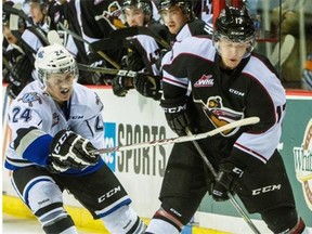 Vancouver Giants Tyler Benson, right battles for the puck with Victoria Royals Regan Nagy, left during regular-season WHL action at the Pacific Coliseum in Vancouver, B.C. Sunday September 28, 2014.