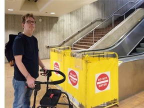 Ian Young stands beside a closed escalator at Central LRT station in Edmonton on August 23, 2015. A new city report says that escalators and elevators have been breaking down much less frequently, but individuals like Young still worry that maintenance problems could leave them stranded.