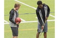 Canadian athletes Connor McDavid, left, 2015 First Overall NHL Draft Pick and Andrew Wiggins, 2015 NBA Rookie of the Year, joke around trading their stick and basketball respectively during a break in shooting a BioSteel sports drink commercial in Toronto on Tuesday, August 4, 2015.