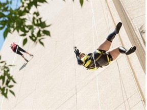 For the 10th anniversary of the Easter Seals Drop Zone, about 70 people dressed as superheroes rappelled 29 stories or 261 feet from the top of Sutton Place Hotel. Kadin Puttick was on the ground to propose to his girlfriend Amanda Shairp dressed as Silk Spectre from Watchmen. She said yes.