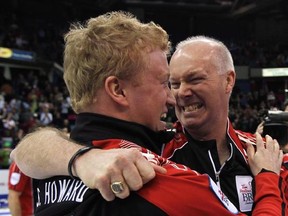 Ontario skip Glenn Howard, right, celebrates his teams gold medal win over Alberta with alternate Scott Howard at the Tim Hortons Brier in Saskatoon, Sask., on March, 11, 2012. Scott Howard was the first one on the ice to celebrate when his father skipped the Canadian team to a world curling title three years ago in Basel, Switzerland. At the time, Howard was an alternate. Now he&#039;s hoping to return to such heights as a full-time player on the squad. Howard will serve as lead on a revamped Team G