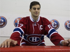 New Montreal Canadiens team captain Max Pacioretty sits on the bench at the Bell Sports Complex in Brossard near Montreal on Sept. 18, 2015.