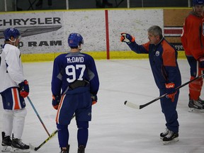 Todd McLellan makes a point to Nail Yakupov and Connor McDavid while Mark Fayne listens in. McLellan had the full attention of every Edmonton Oiler on the ice, whether he was addressing them or not.