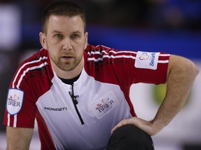 FILE - Newfoundland and Labrador skip Brad Gushue watches his shot as his team plays Ontario during curling action at the Brier in Calgary on March 3, 2015.