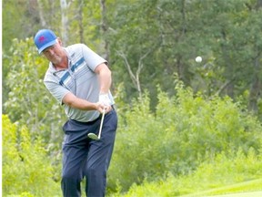 Calgary’s Darryl James chips onto the 18th green en route to winning the PGA of Alberta club pro championship at the Edmonton Country Club on Aug. 25, 2015.