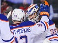 Ryan Nugent-Hopkins and Anders Nilsson, No. 39. of the Edmonton Oilers celebrate their victory over the Calgary Flames during a pre-season NHL game at Scotiabank Saddledome on September 21 in Calgary.