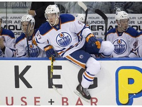 Edmonton Oilers rookie Connor McDavid jumps off the bench for a shift against the University of Alberta Golden Bears during an exhibition game at Rexall Place on Sept. 16, 2015.