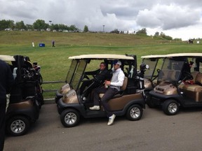 Edmonton hockey player Jordan Eberle waits in a golf cart for a real 'shotgun' start in the Oilers' first annual charity golf tournament on Monday at Blackhawk Golf Club.