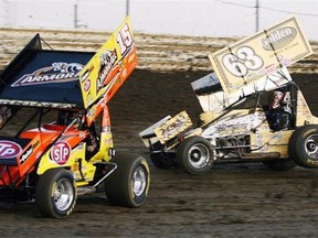 Donny Schatz (car No. 15) and Chad Kemenah compete in the Oil City Cup on Aug. 27, 2010. The World of Outlaws Sprint Car Series returns to Castrol Raceway for the ninth year in a row on Friday and Saturday.