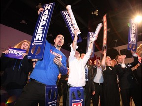 Conservative supporters cheer as federal election results roll in at Conservative Party campaign headquarters at the Telus Convention Centre in Calgary Monday evening May 2, 2011.