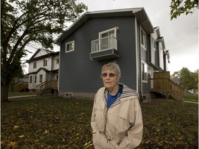 Barb Heather stands in front of large duplex in Eastwood on September 14, 2015 in Edmonton. She would like to see more diversity in her neighbourhood.