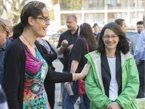 Edmonton's Catholic School board Trustee Patricia Grell leaves the downtown office. She spoke out about the district's decision to require a transgendered child to use an all-gender bathroom, as opposed to the girls' washroom. Transgender woman Marni Panas offers her support to Grell outside the school board office.