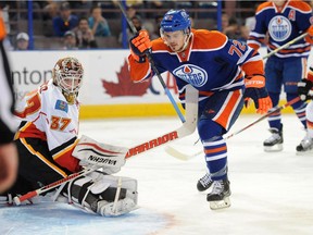 Greg Chase of the Edmonton Oilers, celebrates a second period goal on Joni Ortio of the Calgary Flames in 2014 preseason NHL action at Rexall Place in Edmonton.