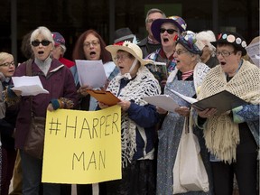 Singers, musicians and activists sing Harperman on Sept. 17, 2015 at Centennial Square in Edmonton.