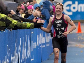 Vicky Holland of Great Britain finishes first in the elite women's race at the ITU World Triathlon at Hawrelak Park on Sept. 6, 2015.