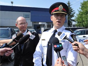 EDMONTON, ALBERTA, AUGUST 13, 2013: EPS Supt. Kevin Galvin and Karl Wilberg, Dir. of Alberta Justice's Forfeiture Office, speak to media about a car forfeiture after a road rage incident in Edmonton, Ab. on Tuesday Aug. 13, 2013.  (photo by John Lucas/Edmonton Journal)(for a story by Mariam Ibrahim)