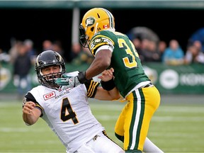 The Edmonton Eskimos defence didn't make many plays against Hamilton Tiger-Cats quarterback Zach Collaros, although defensive back Ryan Hinds managed to hit him on this play, in a Canadian Football League game at Commonwealth Stadium on Aug. 21, 2015.
