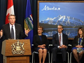 The Alberta government introduced the province's royalty review panel in Edmonton on Aug. 28, 2015. From left, chairman Dave Mowat, Annette Trimbee, Peter Tertzakian and Leona Hanson.