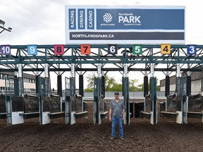 Brian Walper, works at the starting gate loading horses for races at the track at Northlands in Edmonton on Wednesday July 15, 2015.