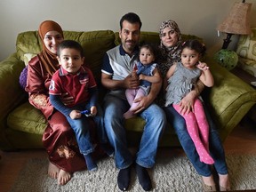 Adults (L-R) Ghada Al-Adhami, Mohammad Aljammal and his wife Heba Alhaffar with (L-R) Ghasan Al-Jamal, 3, Shaam Al-Jamal, 2, and Naheed Aljammal, 3, are Syrian refugees living in Edmonton.