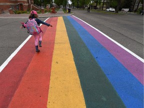 6 year old Kenzy Francis crosses a rainbow coloured crosswalk in Old Strathcona in Edmonton on Tuesday Jun 2, 2015.