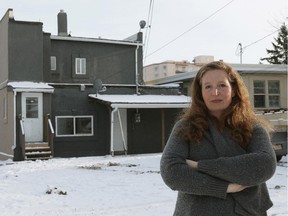 Tracy Patience stands near an apartment owned by Carmen Pervez located at 11242- 86 Street in Edmonton. Patience is a resident in the neighbourhood.