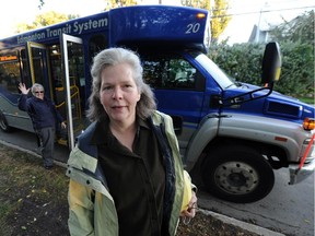 Raquel Faroe prepares to board community bus 308 in Riverdale early in the morning as bus driver Jan awaits.