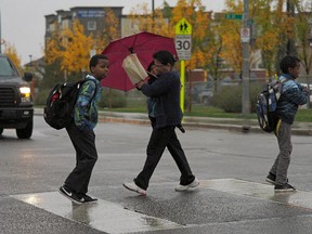 Pedestrians and traffic near Dr. Donald Massey Elementary-Junior High School in Edmonton on Sept. 15, 2015. The city is launching a new parking enforcement campaign regarding safety around school zones.
