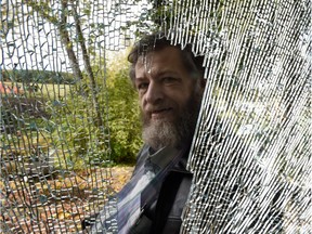 Henry Neumann, who says a nearby fracking operation shattered his patio window, is upset by the enterprise on his acreage near Devon on Thursday Sept. 17, 2015.
