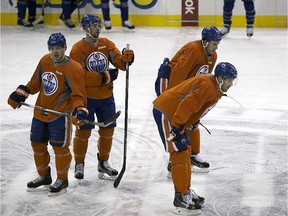 Edmonton Oilers players take a break during team practice at Rexall Place on Sept. 22, 2015.