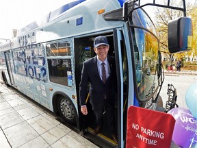 Mayor Don Iveson unveils the specially wrapped What Moves You? Engagement Bus outside the AGA during the official launch of the transit strategy What Moves You? project that will shape the future of Edmonton's transit system on Monday, Sept. 28, 2015.