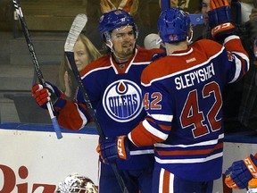 Edmonton Oilers Anton Lander (left) celebrates his second goal of the game against the Arizona Coyotes during second-period pre-season NHL action at Rexall Place on Sept. 29, 2015. Oilers' Anton Slepyshev celebrates with Lander.