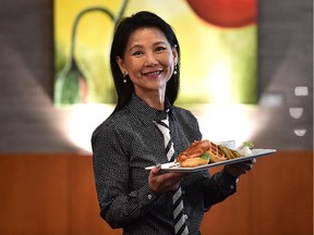 Tan Lim, co-owner of the Wildflower Grill, with chicken and waffles, on the restaurant's extensive and interesting brunch menu.