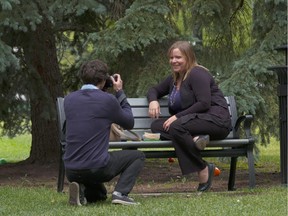 Shayne Woodsmith photographs Kristy Leinweber for his blog Faces of Edmonton in Edmonton on July 16, 2015. His new book is based on the photos and interviews from his blog.