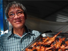 David Vu from Hoang Long restaurant with Quail in a Pomegranite sauce at A Taste of Edmonton  at Churchill square in Edmonton, July 19, 2012.