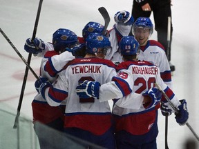 The Edmonton Oil Kings celebrate a goal against the Red Deer Rebels during a Western Hockey League pre-season game on Sept. 5, 2015, at St. Albert's Servus Credit Union Place.