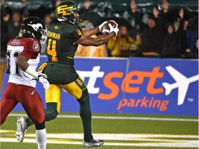 Edmonton Eskimos Adarius Bowman parks the ball in the end zone for a TD against the Calgary Stampeders during CFL action at Commonwealth Stadium in Edmonton, Sept. 12, 2015.